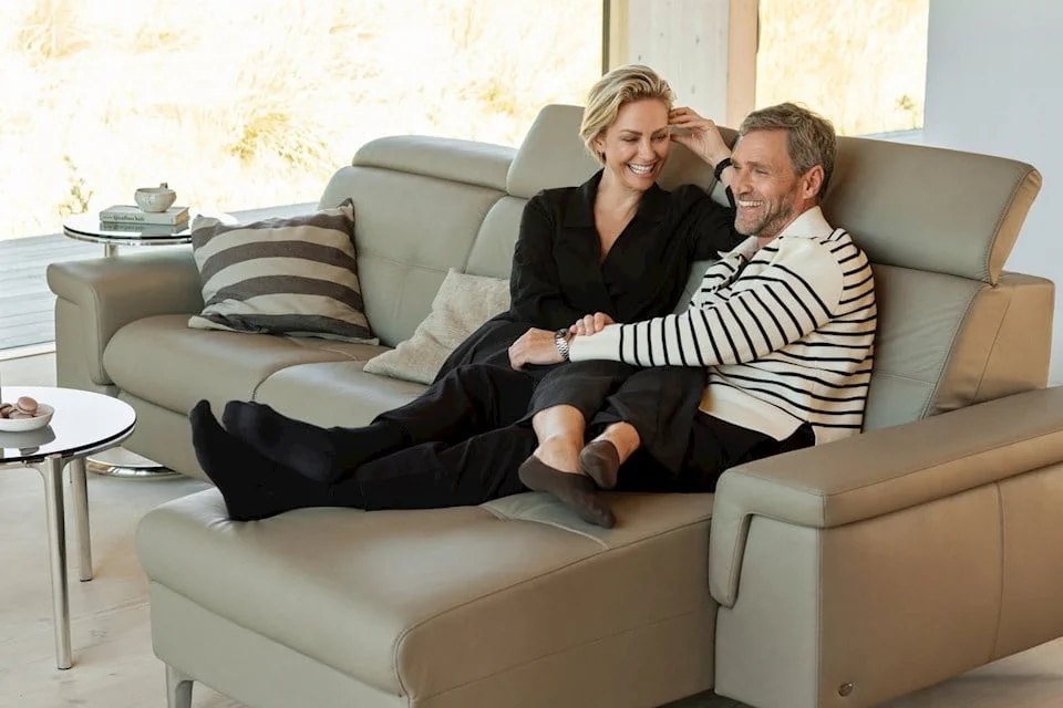 Couple relaxing on a Stressless Anna reclining sofa