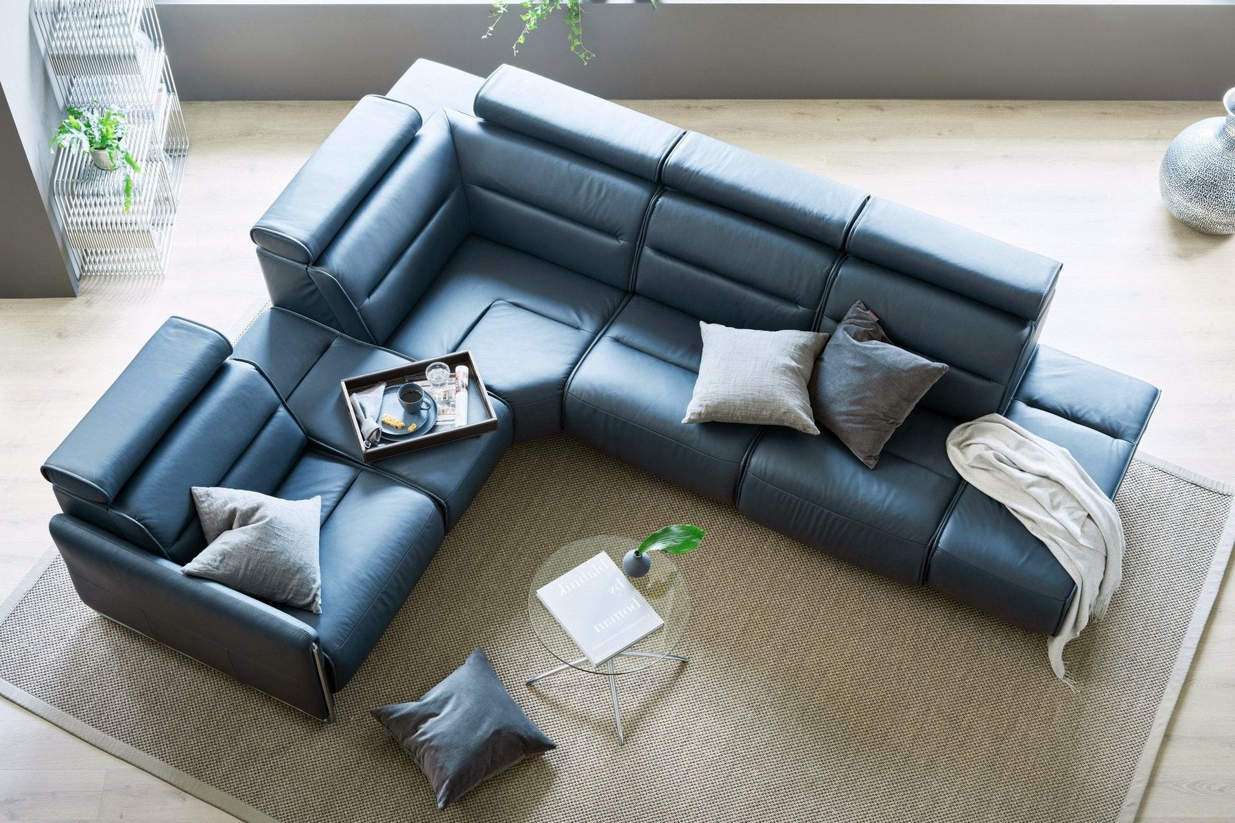 Stressless Emily sectional sofa in blue leather with a chaise module in a modern living room