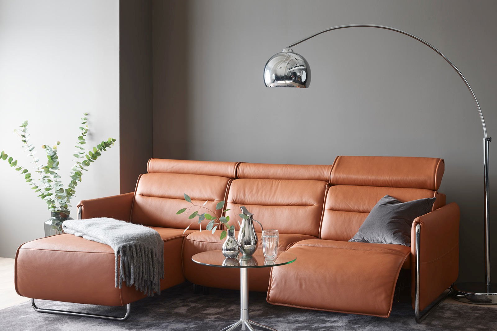 Stressless Emily power sofa in New Cognac leather with a footstool