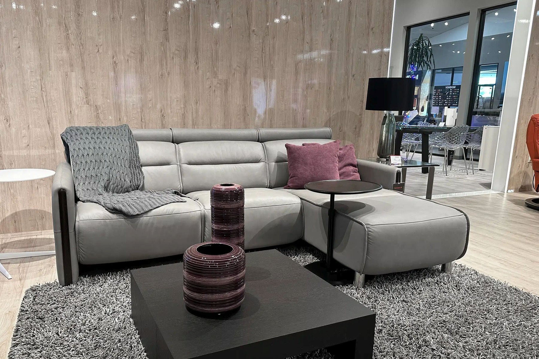 Stressless Emily sofa and ottoman in Paloma Silver Grey leather in a living room
