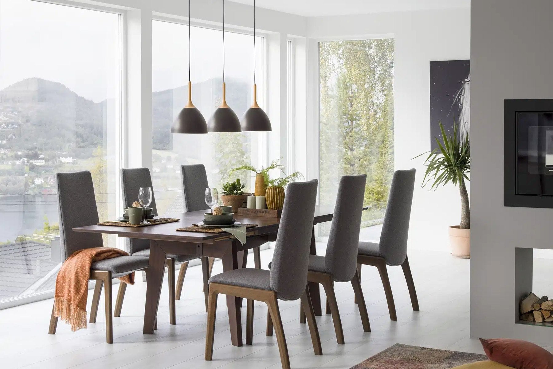 Stressless Laurel high-back dining chairs around a dining table in a bright dining room