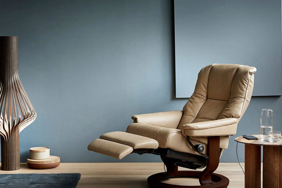 Stressless Mayfair power recliner in Paloma Sand leather with the footrest extended