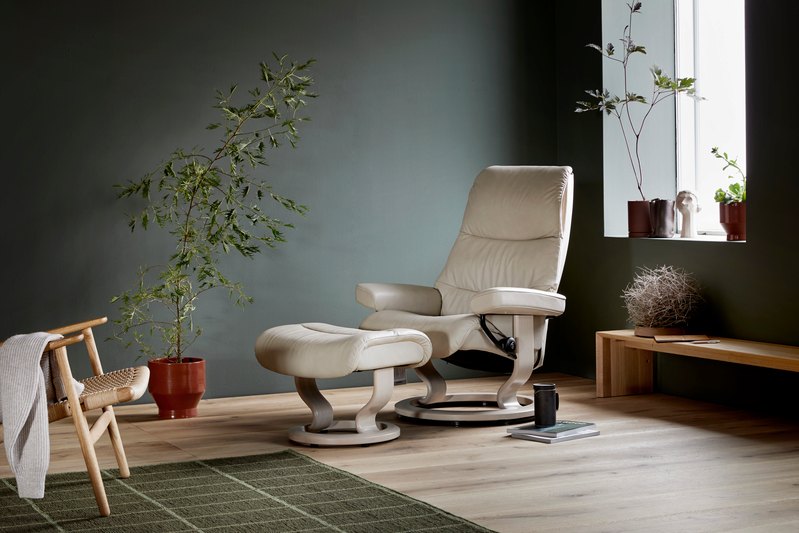 Stressless View Classic recliner and ottoman in a light cover in a living room
