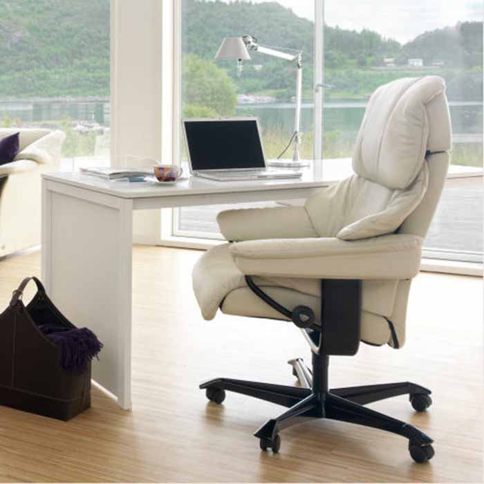 Stressless Reno home office chair in cream leather at a white desk, side view