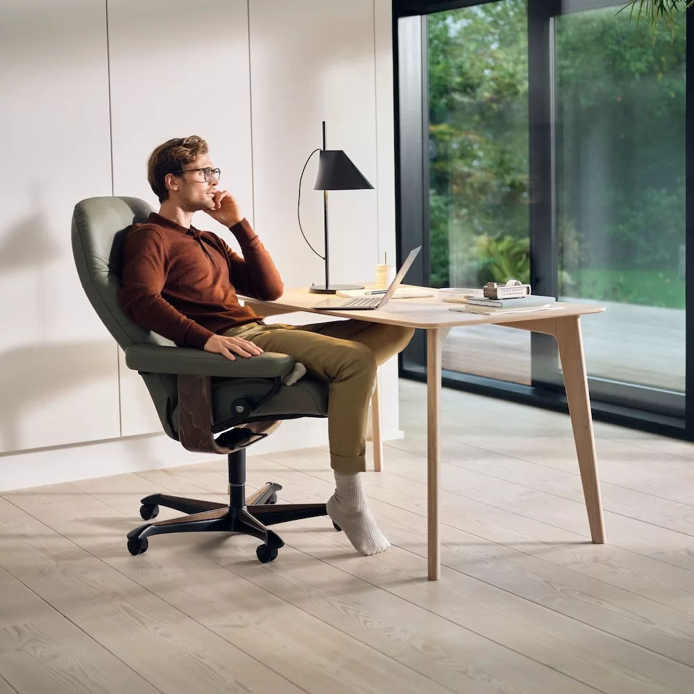 Stressless Consul home office chair in green leather in a modern home office