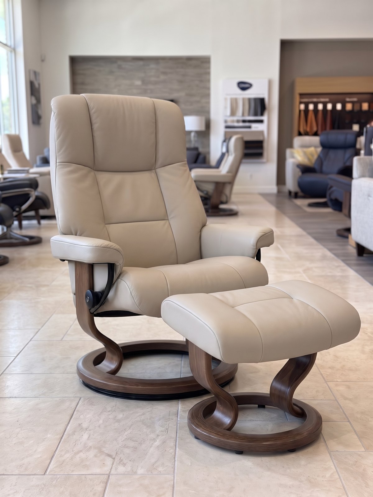 Stressless Mayfair Medium Classic recliner and ottoman in Paloma Sand leather with a Brown stain Classic base, In-Stock Special at Haynes Comfort